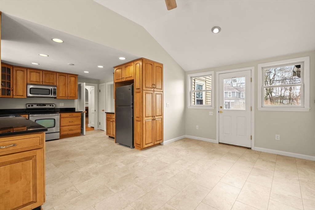 630 Pleasant Street Canton, MA 02021 - Photo 8 of 31 a view of kitchen with stainless steel appliances granite countertop a refrigerator and microwave