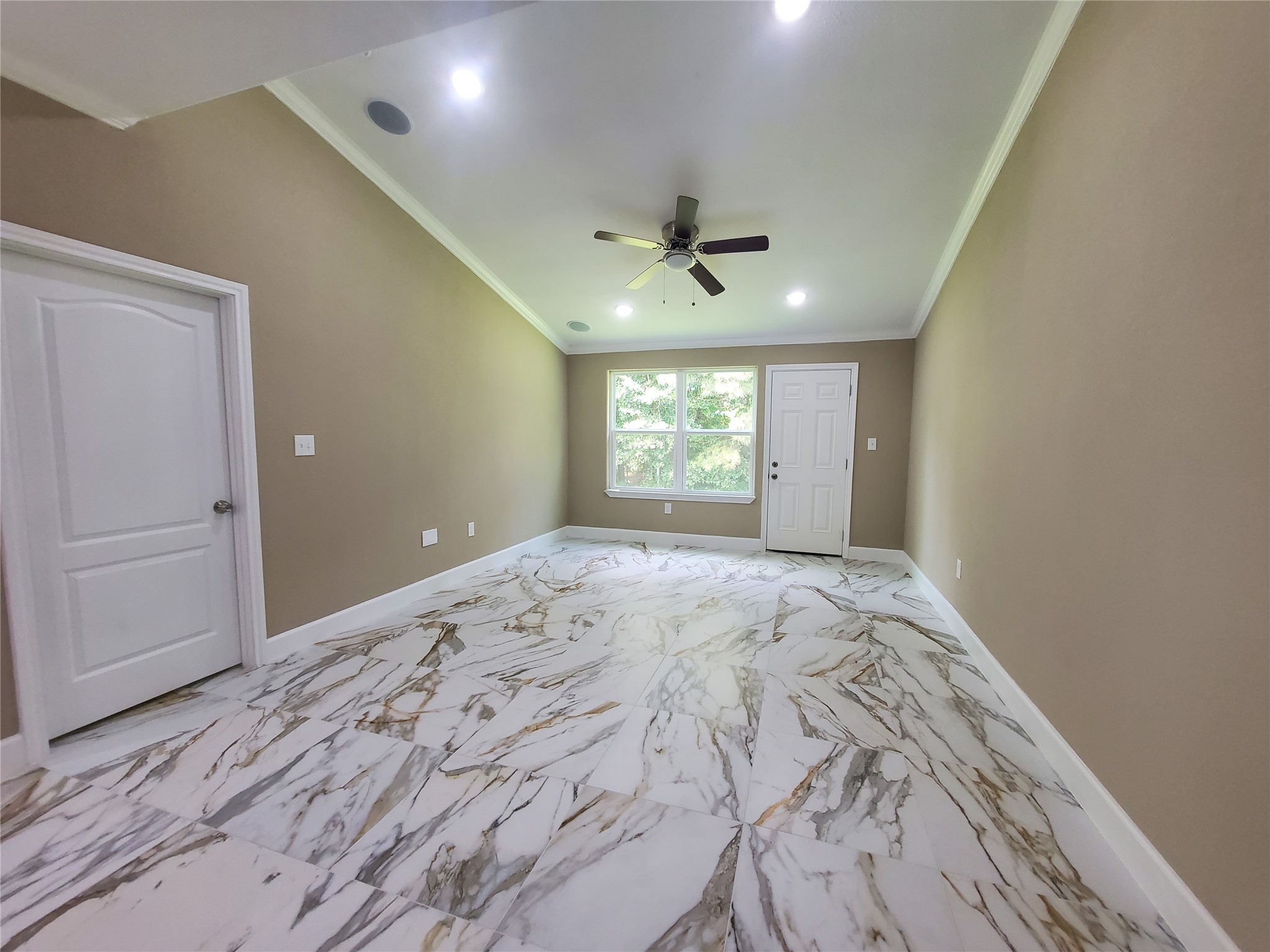 1306 North 9th Street Conroe, TX 77301 - Photo 8 of 47 a view of empty room with window and ceiling fan