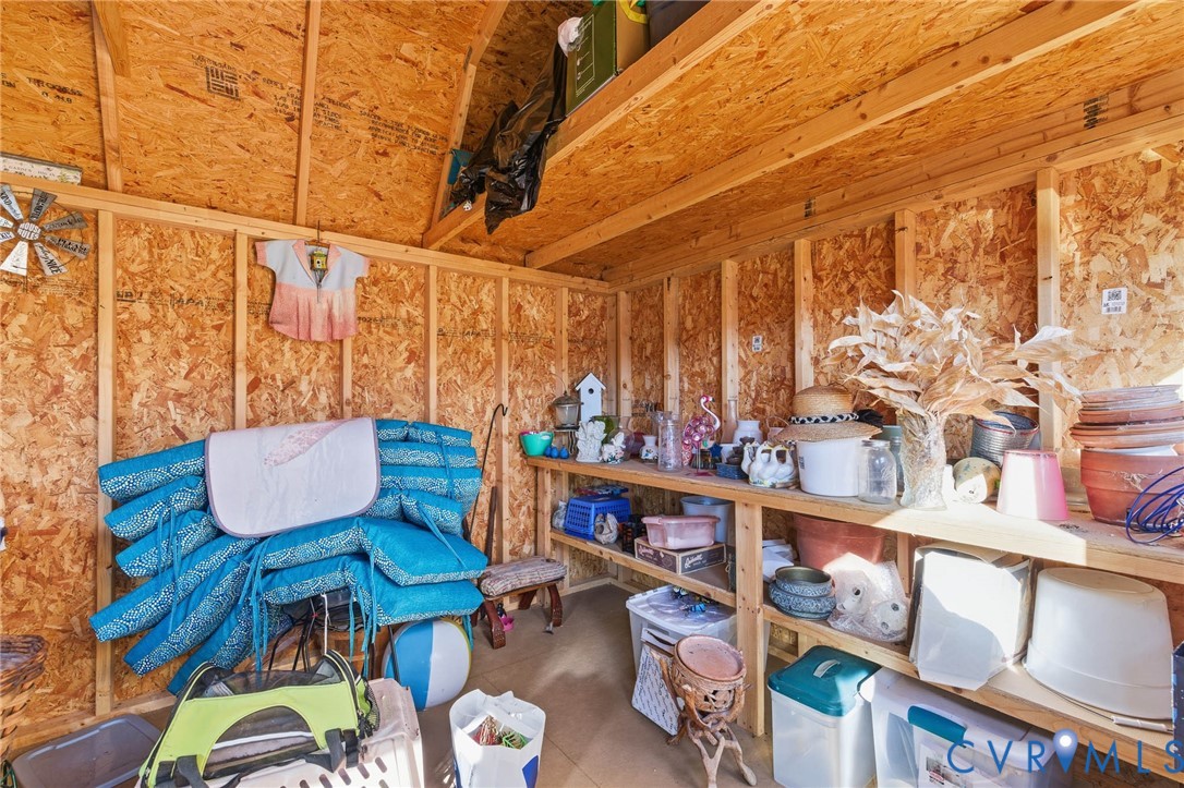 15900 Nobles Road Disputanta, VA 23842 - Photo 26 of 36 Shelves and loft area inside the shed