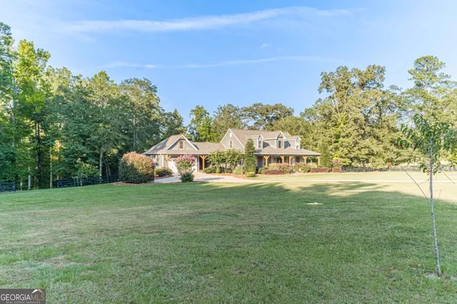 a view of a swimming pool with a yard