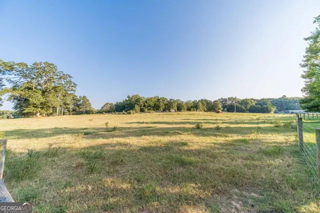 a view of walk in closet with clothes