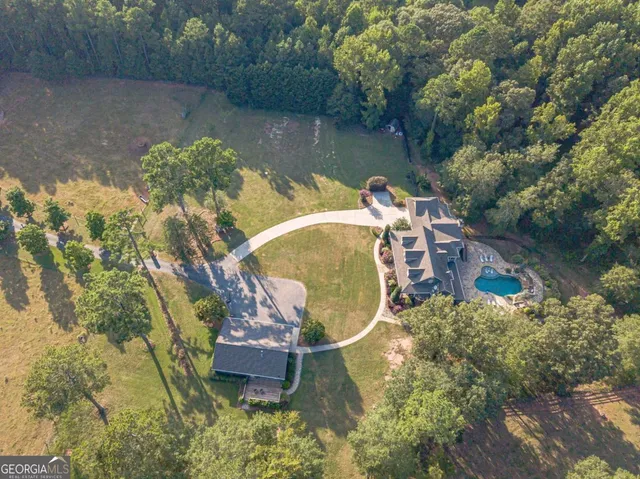 a view of a swimming pool with outdoor seating
