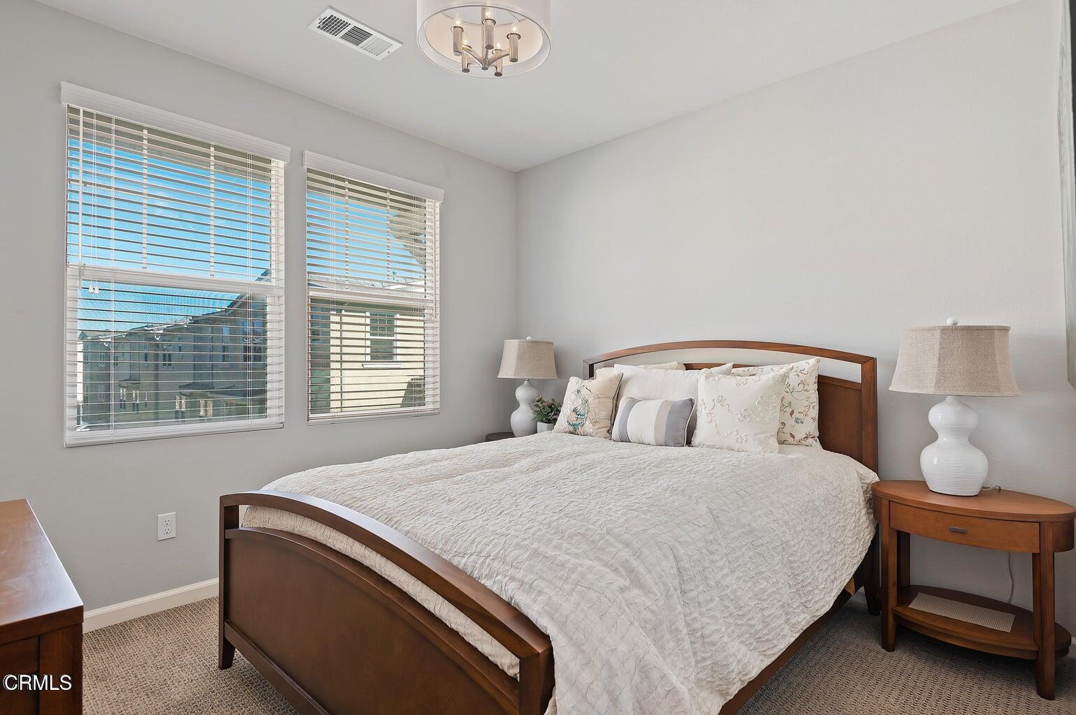 3661 West Hemlock Street Oxnard, CA 93035 - Photo 16 of 21 a bedroom with a bed and window