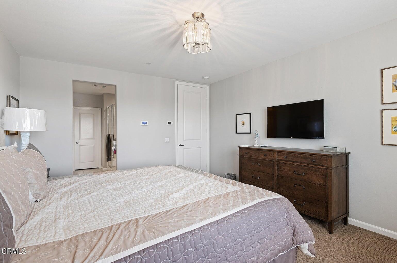 3661 West Hemlock Street Oxnard, CA 93035 - Photo 19 of 21 a bedroom with a bed and a flat screen tv