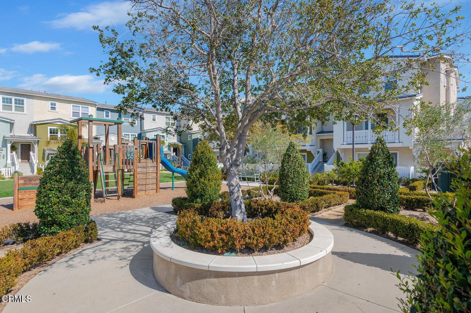 3661 West Hemlock Street Oxnard, CA 93035 - Photo 2 of 21 a white building with outdoor seating and plants