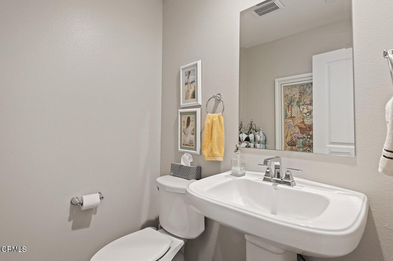 3661 West Hemlock Street Oxnard, CA 93035 - Photo 21 of 21 a bathroom with a sink and a toilet