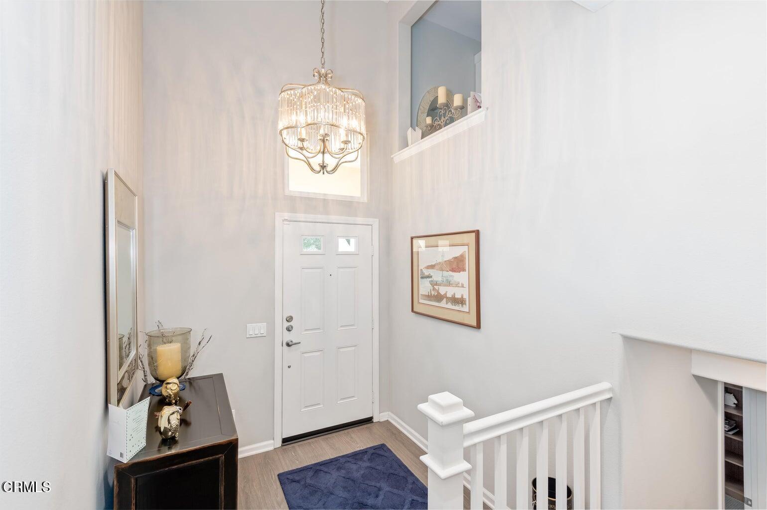 3661 West Hemlock Street Oxnard, CA 93035 - Photo 3 of 21 a view of an entryway with wooden floor