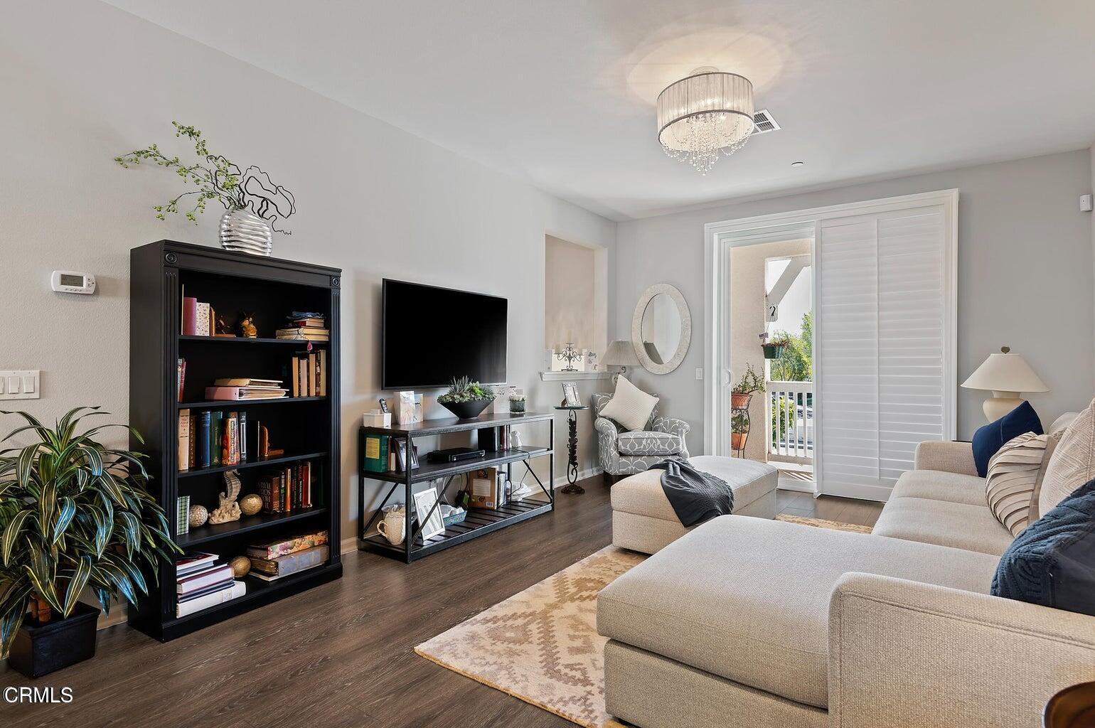 3661 West Hemlock Street Oxnard, CA 93035 - Photo 10 of 21 a living room with furniture and a flat screen tv