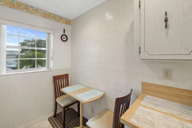 a view of a room with furniture and window