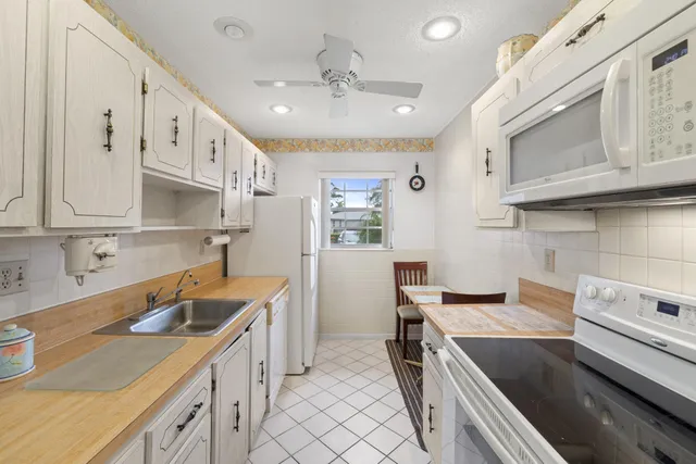a kitchen that has a sink and a stove