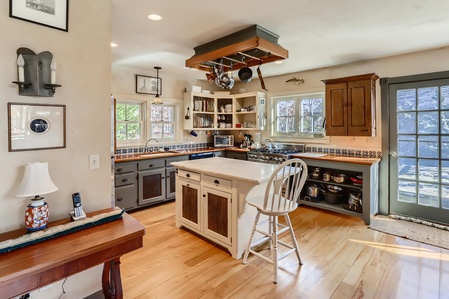 40 Bridle Path Road Vineyard Haven, MA 02568 - Photo 14 of 39 a kitchen with stainless steel appliances a stove a sink dishwasher and cabinets with wooden floor