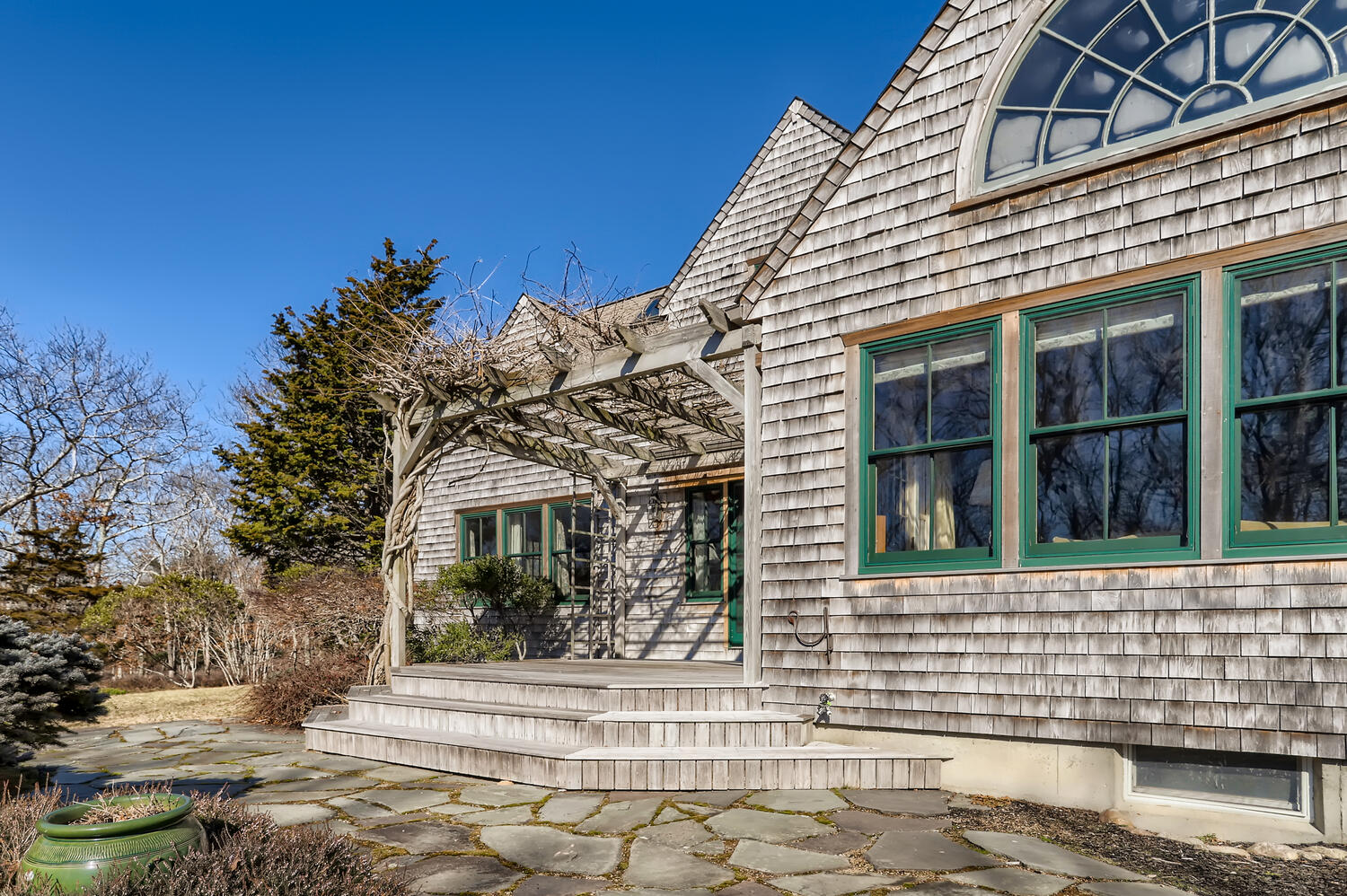 40 Bridle Path Road Vineyard Haven, MA 02568 - Photo 5 of 39 a front view of a house with a yard