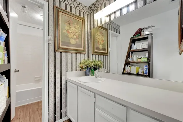 a bathroom with a bathtub and a sink