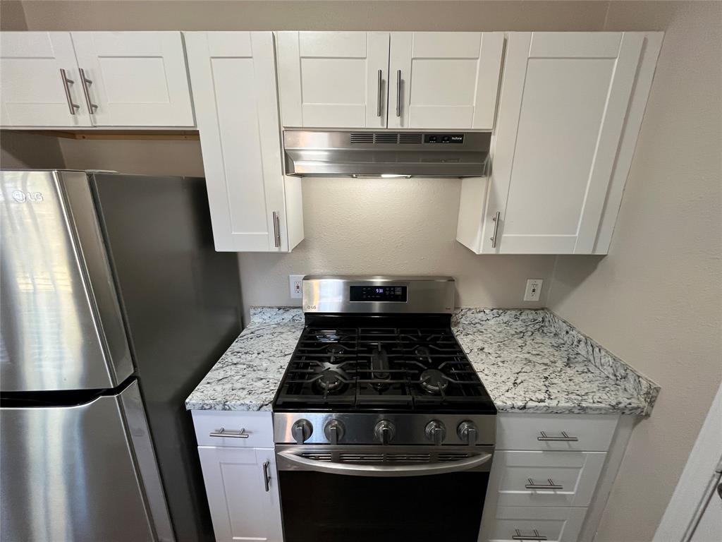 10037 Hymie Circle Dallas, TX 75217 - Photo 12 of 28 a stove top oven sitting inside of a kitchen