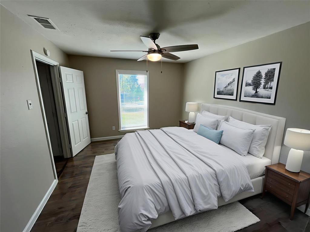 10037 Hymie Circle Dallas, TX 75217 - Photo 15 of 28 a bedroom with a large bed and a window