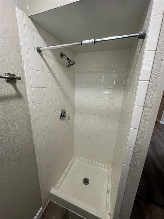10037 Hymie Circle Dallas, TX 75217 - Photo 22 of 28 a bathroom with a glass door shower and a sink