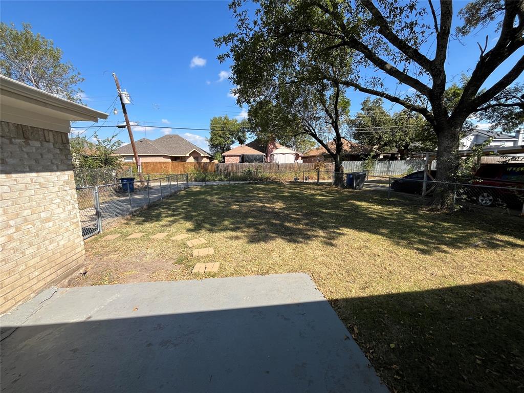 10037 Hymie Circle Dallas, TX 75217 - Photo 26 of 28 a view of a yard with wooden fence
