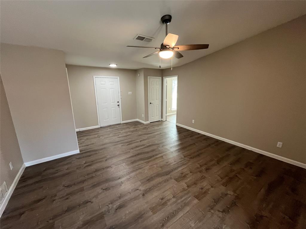 10037 Hymie Circle Dallas, TX 75217 - Photo 5 of 28 a view of an empty room with wooden floor