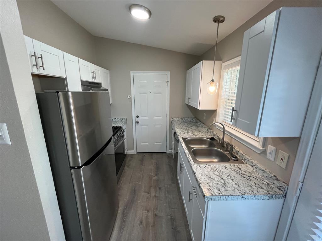 10037 Hymie Circle Dallas, TX 75217 - Photo 10 of 28 a kitchen with stainless steel appliances granite countertop a refrigerator and a sink