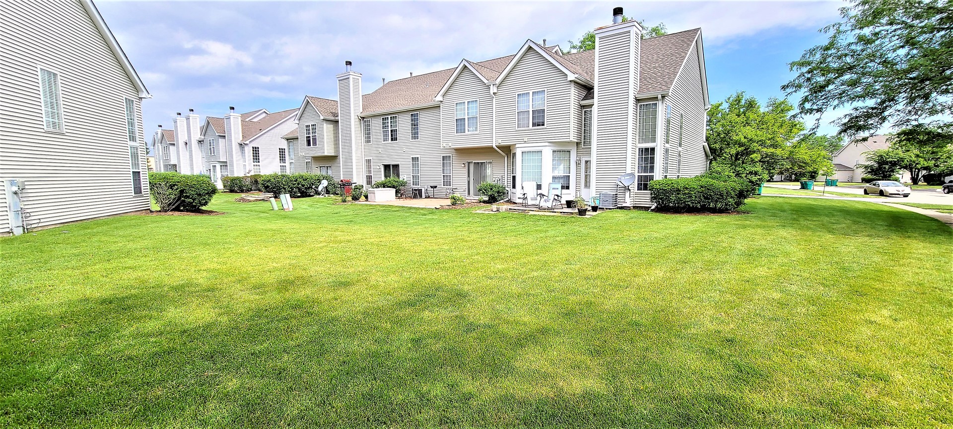 2203 Rossiter Parkway Plainfield, IL 60586 - Photo 2 of 24 a view of a house with a big yard and large trees