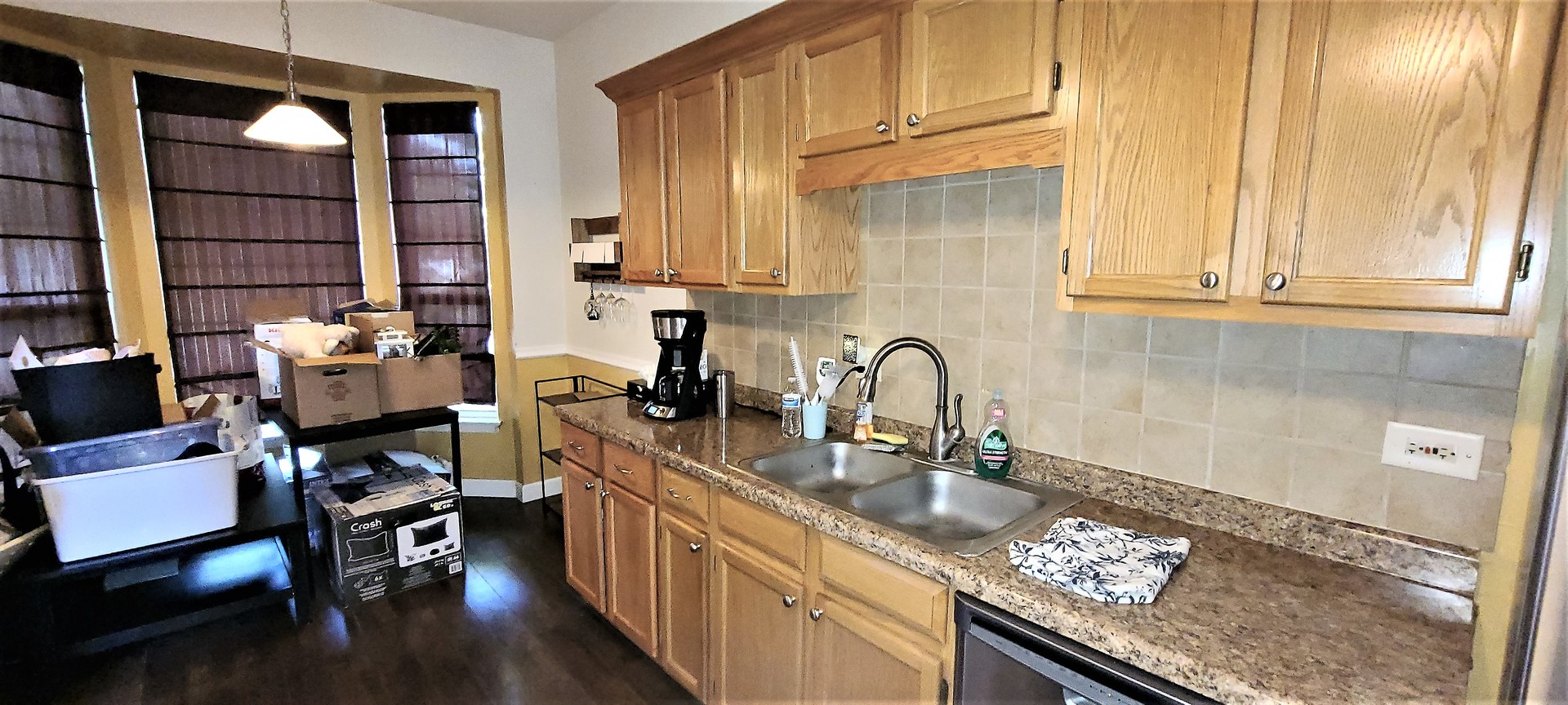 2203 Rossiter Parkway Plainfield, IL 60586 - Photo 12 of 24 a kitchen with granite countertop a sink and a stove