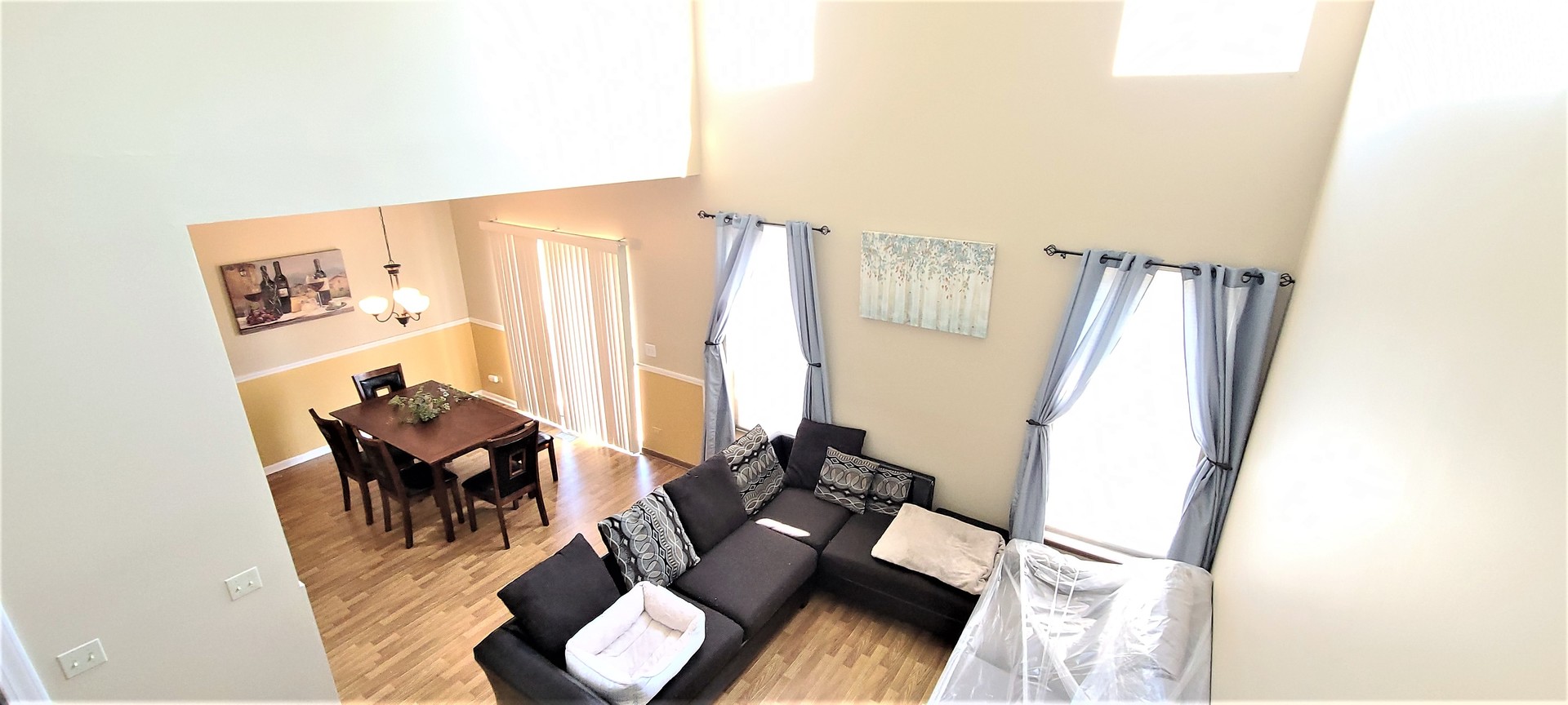 2203 Rossiter Parkway Plainfield, IL 60586 - Photo 15 of 24 a living room with furniture and a wooden floor