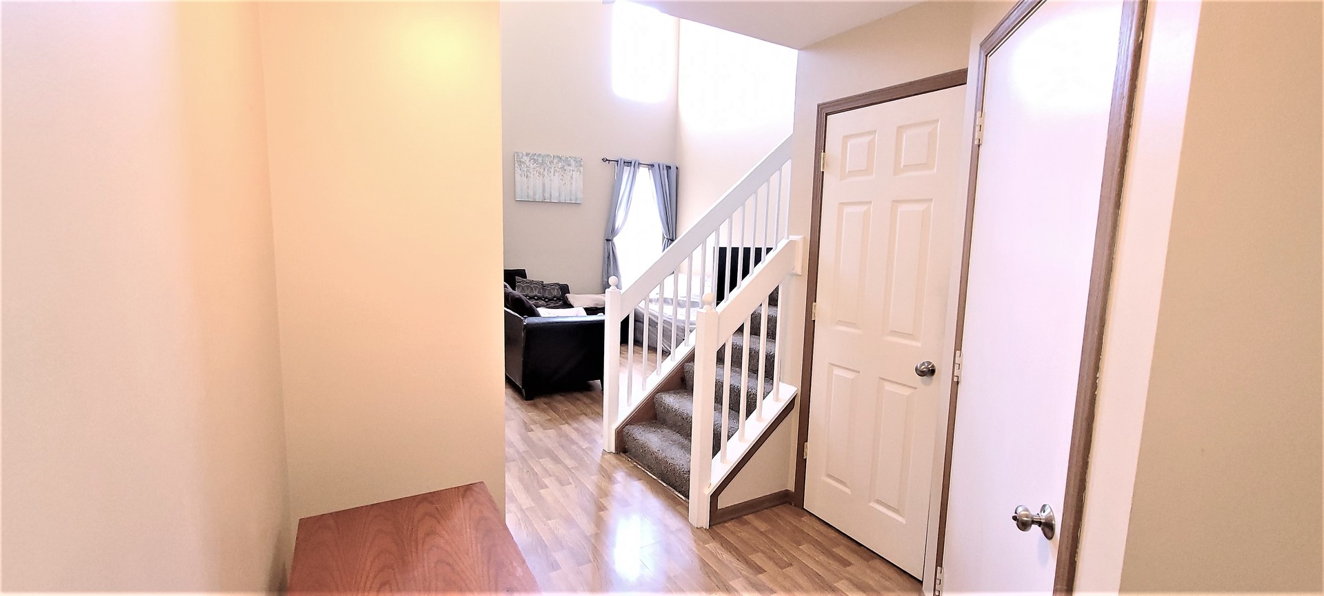 2203 Rossiter Parkway Plainfield, IL 60586 - Photo 5 of 24 a view of a hallway with wooden floor and entryway