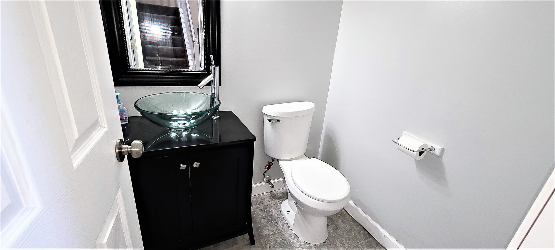 2203 Rossiter Parkway Plainfield, IL 60586 - Photo 8 of 24 a bathroom with a toilet and a mirror