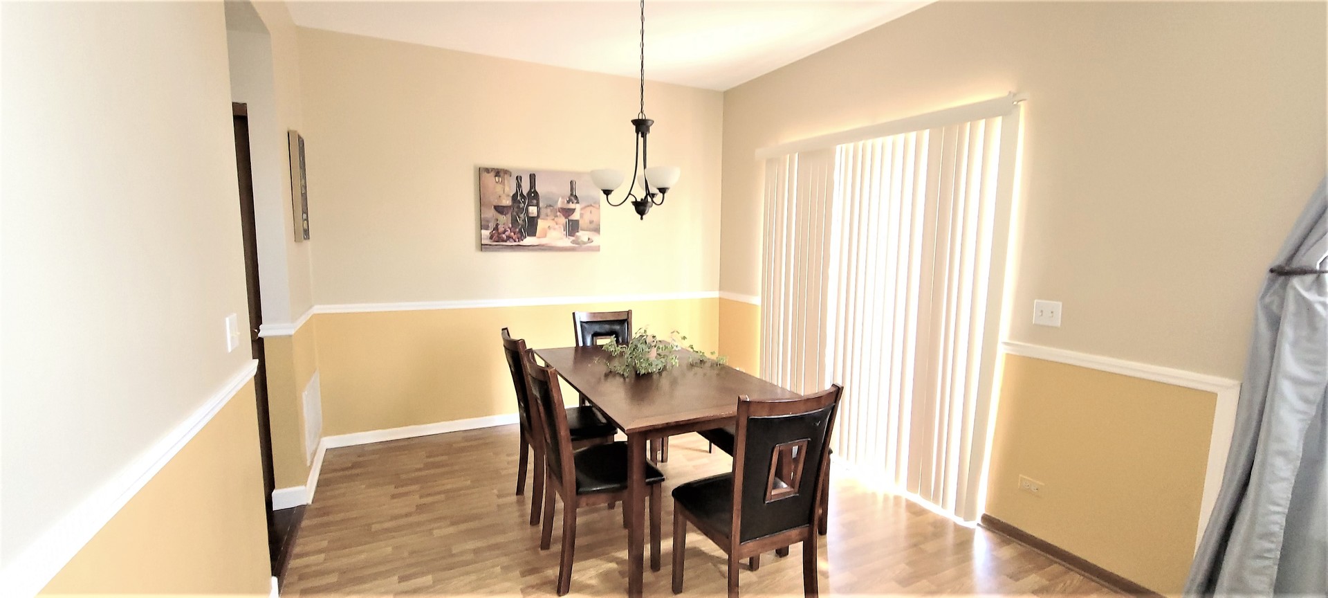 2203 Rossiter Parkway Plainfield, IL 60586 - Photo 10 of 24 a view of a dining room with furniture and wooden floor