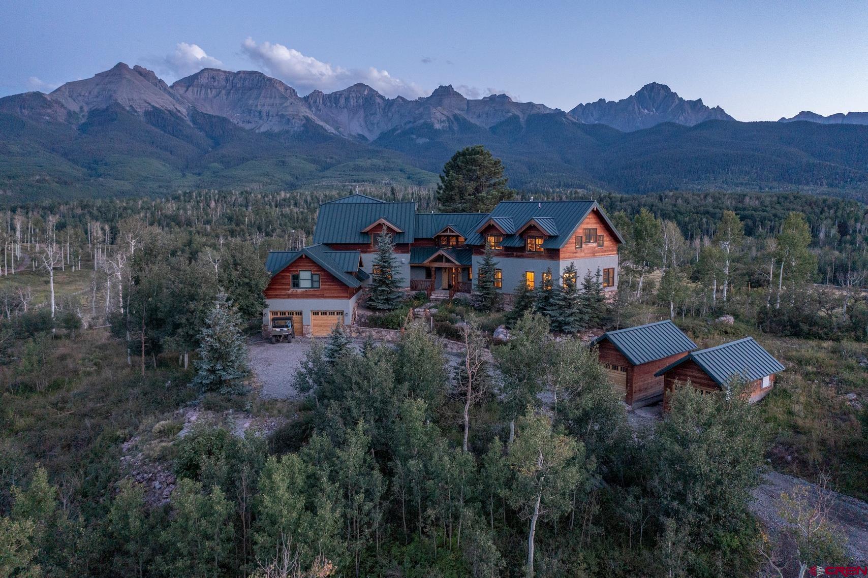 an aerial view of a house with mountain view