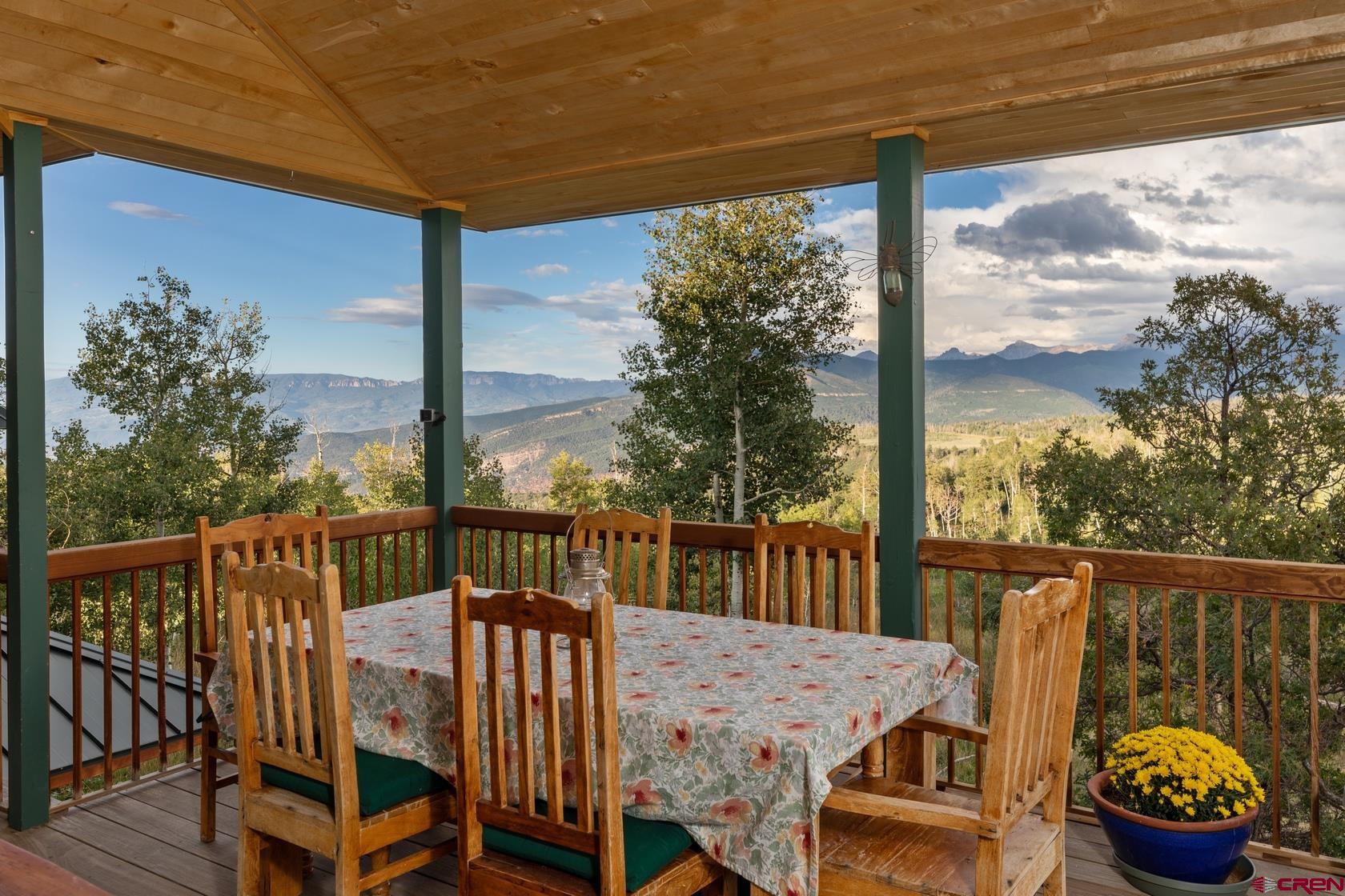 9706 County Road 5 Ridgway, CO 81432 - Photo 11 of 33 a view of a balcony with mountain view and wooden floor