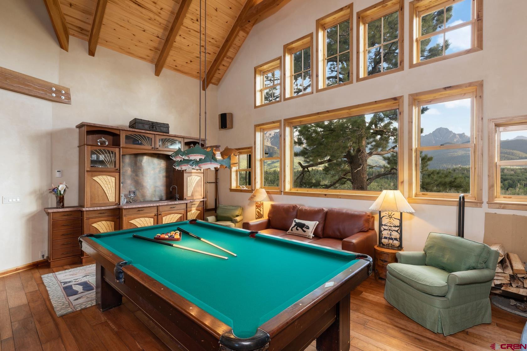 9706 County Road 5 Ridgway, CO 81432 - Photo 12 of 33 a room with furniture pool table and windows