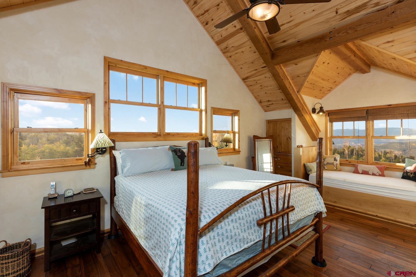 9706 County Road 5 Ridgway, CO 81432 - Photo 15 of 33 a bed room with a bed and a window