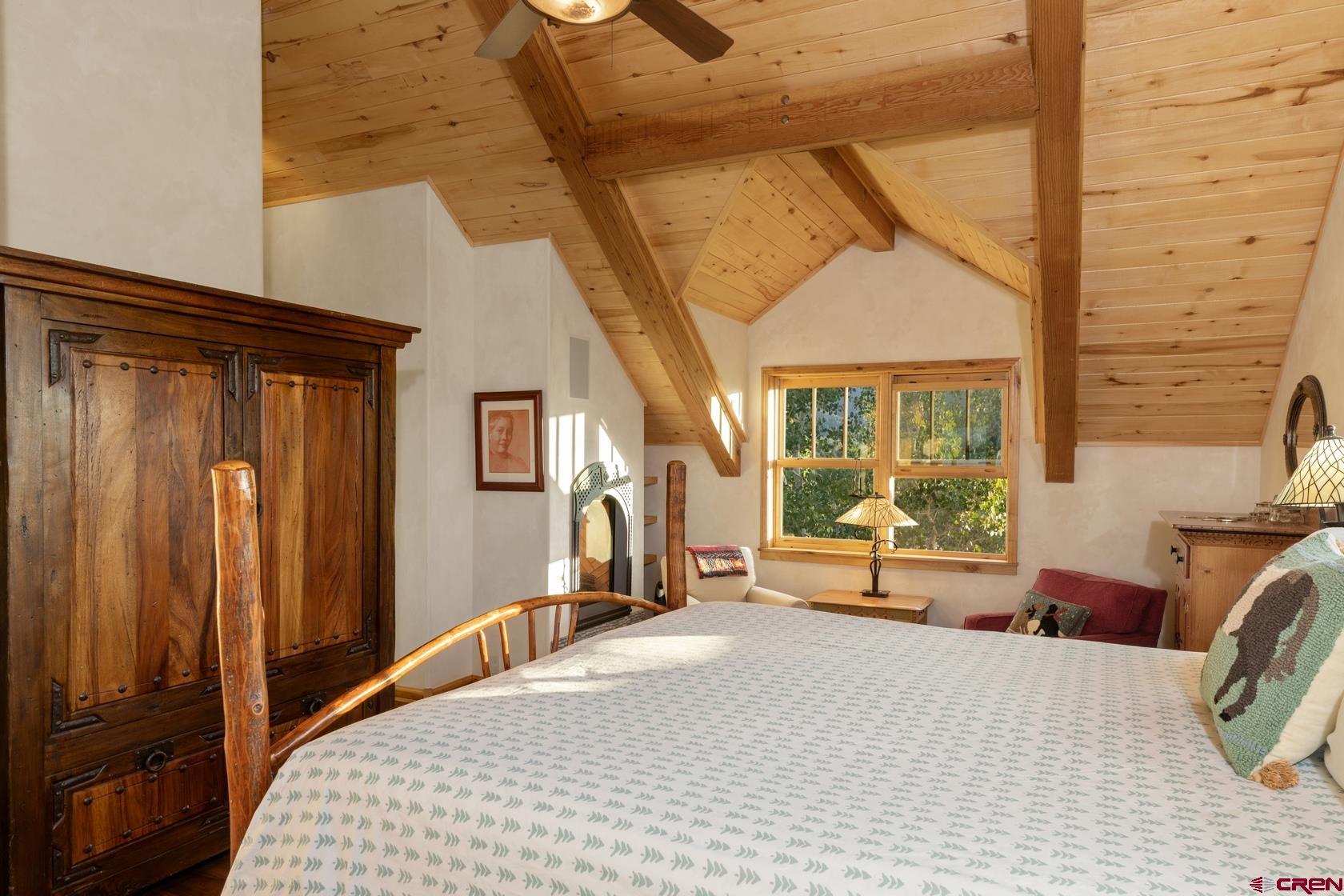 9706 County Road 5 Ridgway, CO 81432 - Photo 16 of 33 a bedroom with a bed and wooden floor