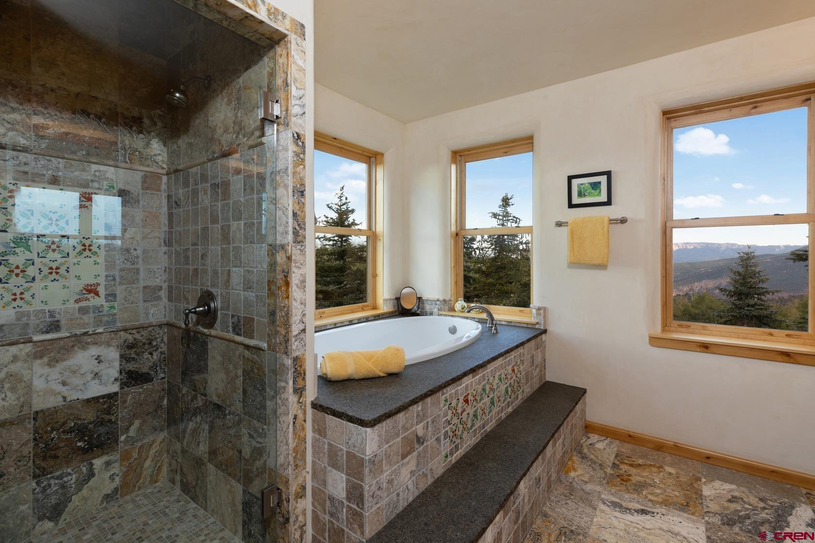 9706 County Road 5 Ridgway, CO 81432 - Photo 18 of 33 a spacious bathroom with sink and shower