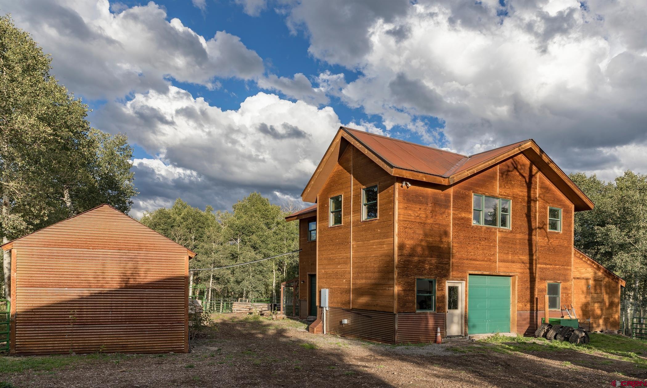 9706 County Road 5 Ridgway, CO 81432 - Photo 32 of 33 a front view of a house with a yard