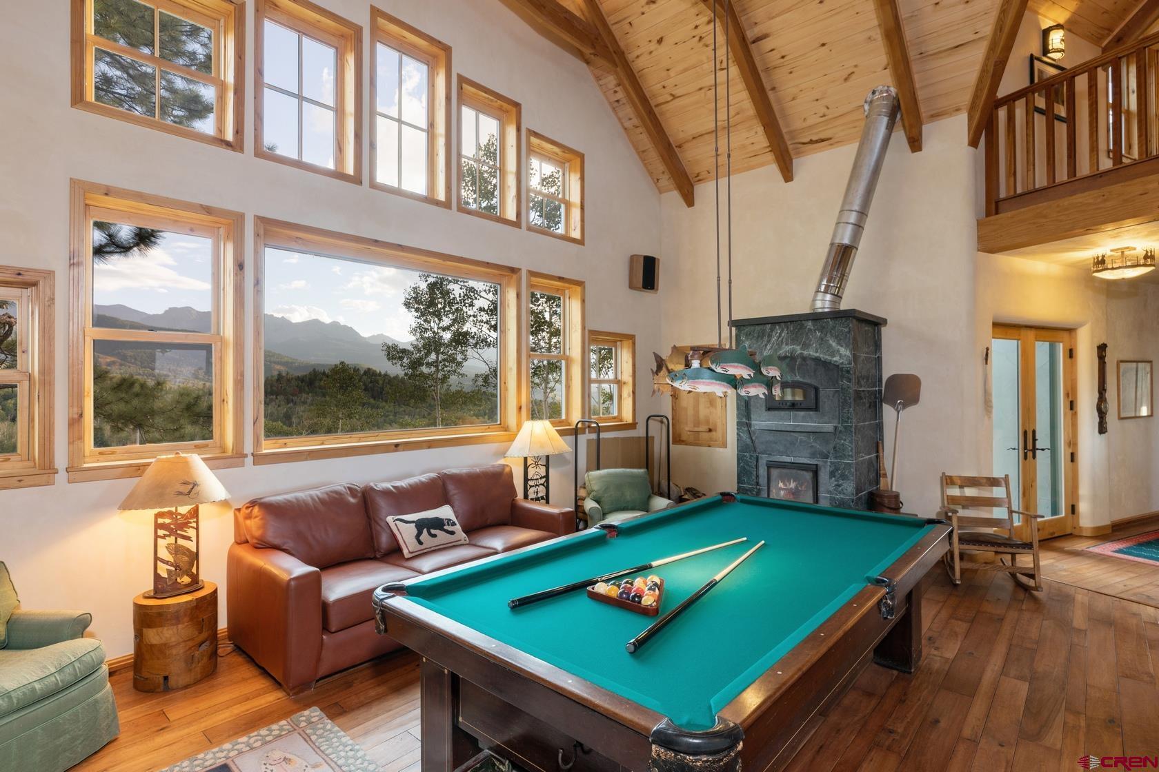 9706 County Road 5 Ridgway, CO 81432 - Photo 7 of 33 a living room with furniture a rug and a floor to ceiling window