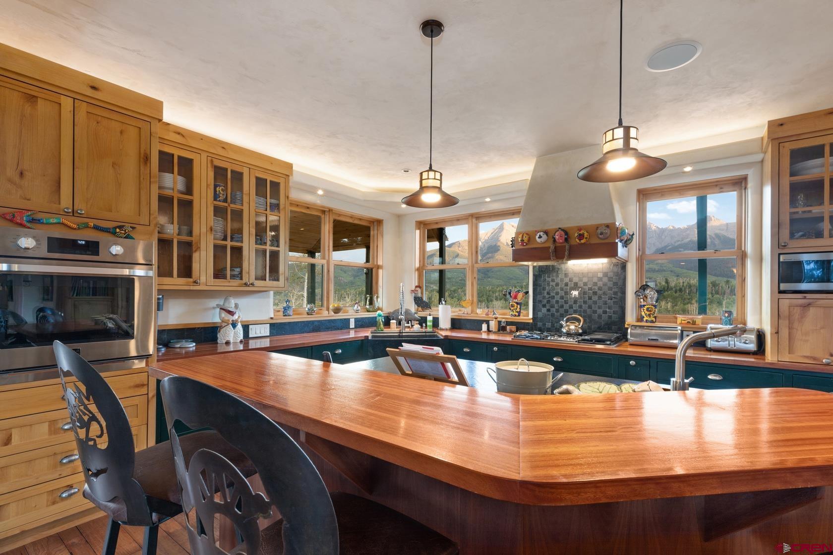 9706 County Road 5 Ridgway, CO 81432 - Photo 8 of 33 a view of a dining room with furniture window and wooden floor