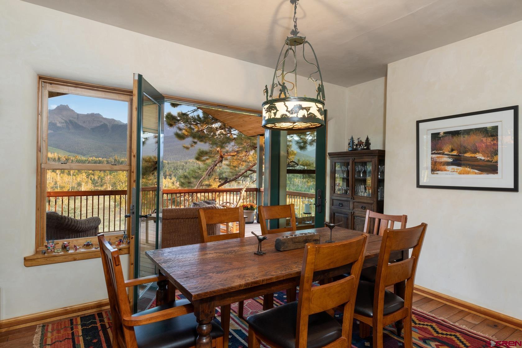 9706 County Road 5 Ridgway, CO 81432 - Photo 10 of 33 a view of a dining room with furniture window and outside view