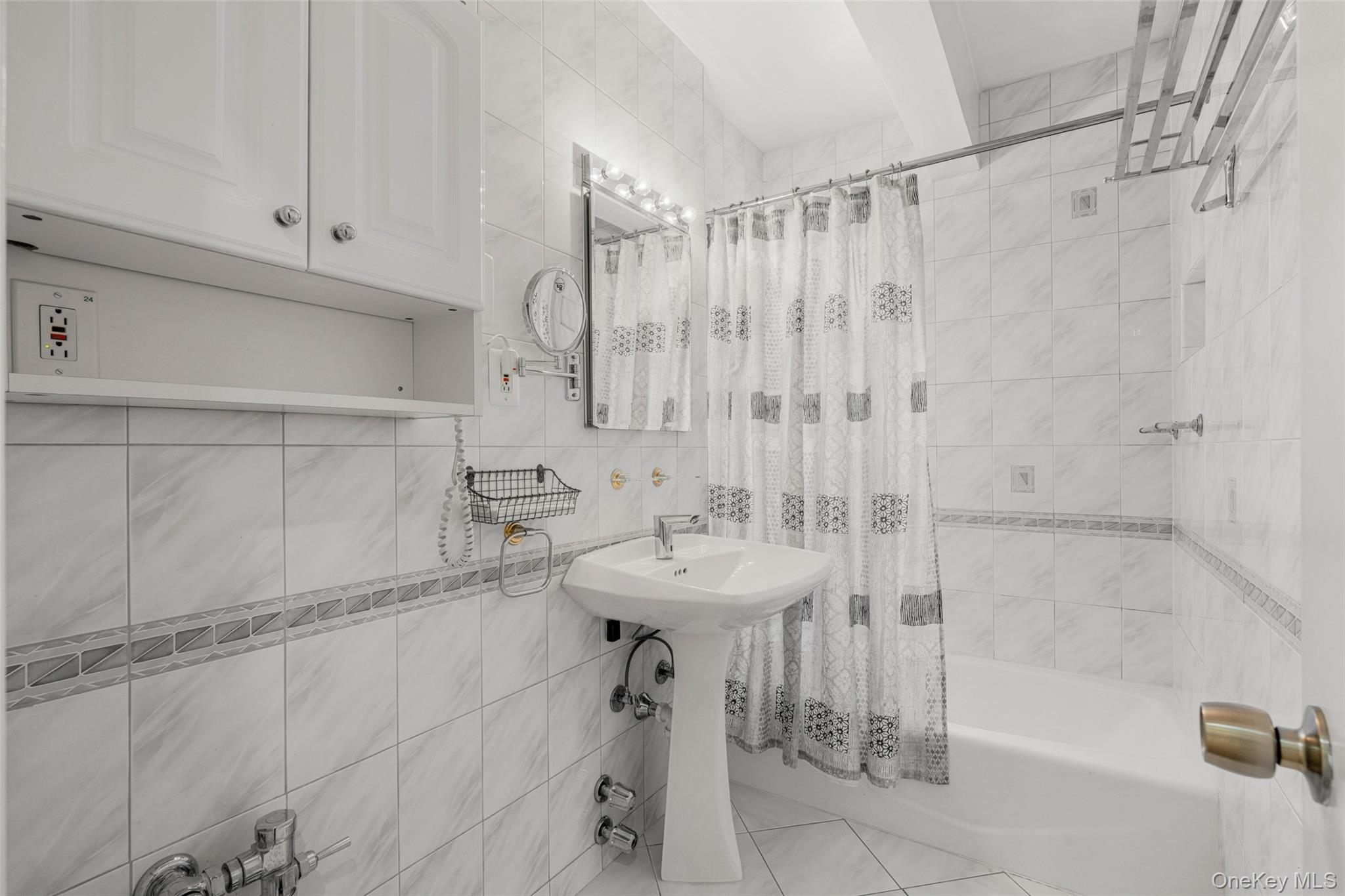 620 West 239th Street, Unit 2C Bronx, NY 10463 - Photo 14 of 19 a bathroom with a sink a toilet and shower