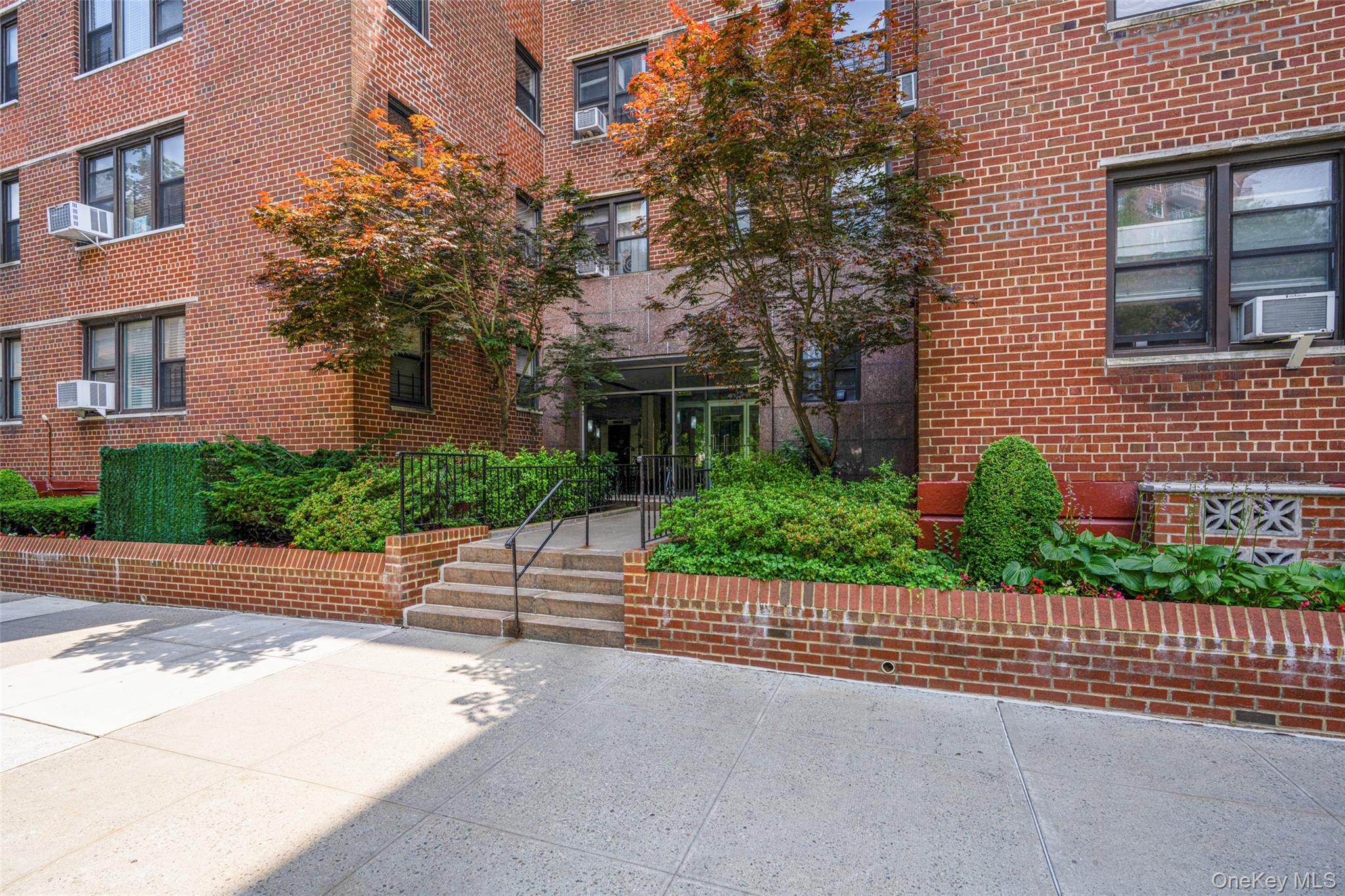 620 West 239th Street, Unit 2C Bronx, NY 10463 - Photo 17 of 19 a front view of a house with a garden