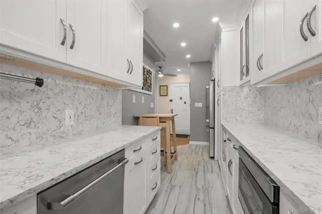 a view of a kitchen with a sink and wooden floor