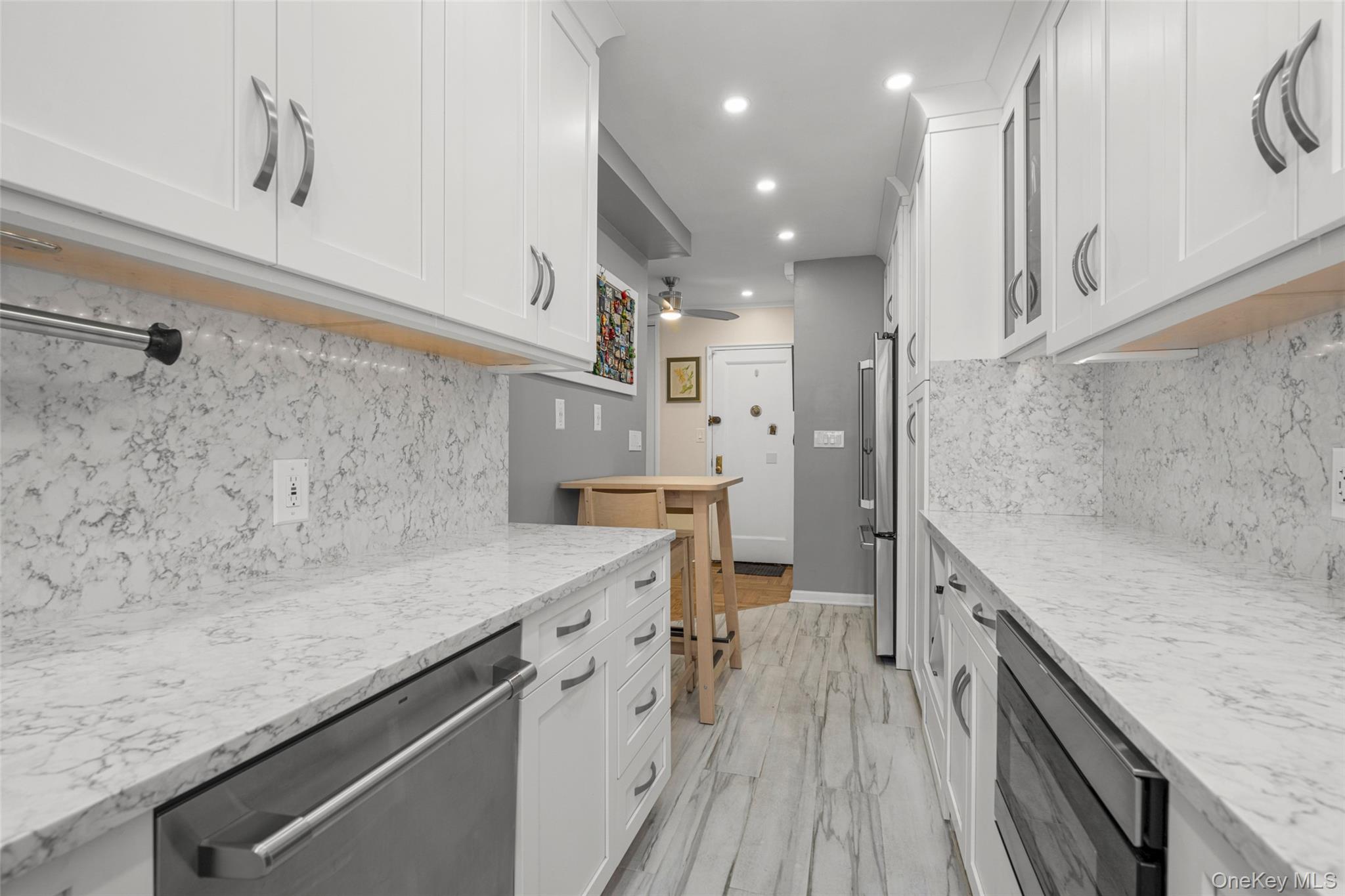 620 West 239th Street, Unit 2C Bronx, NY 10463 - Photo 2 of 19 a view of a kitchen with a sink and wooden floor