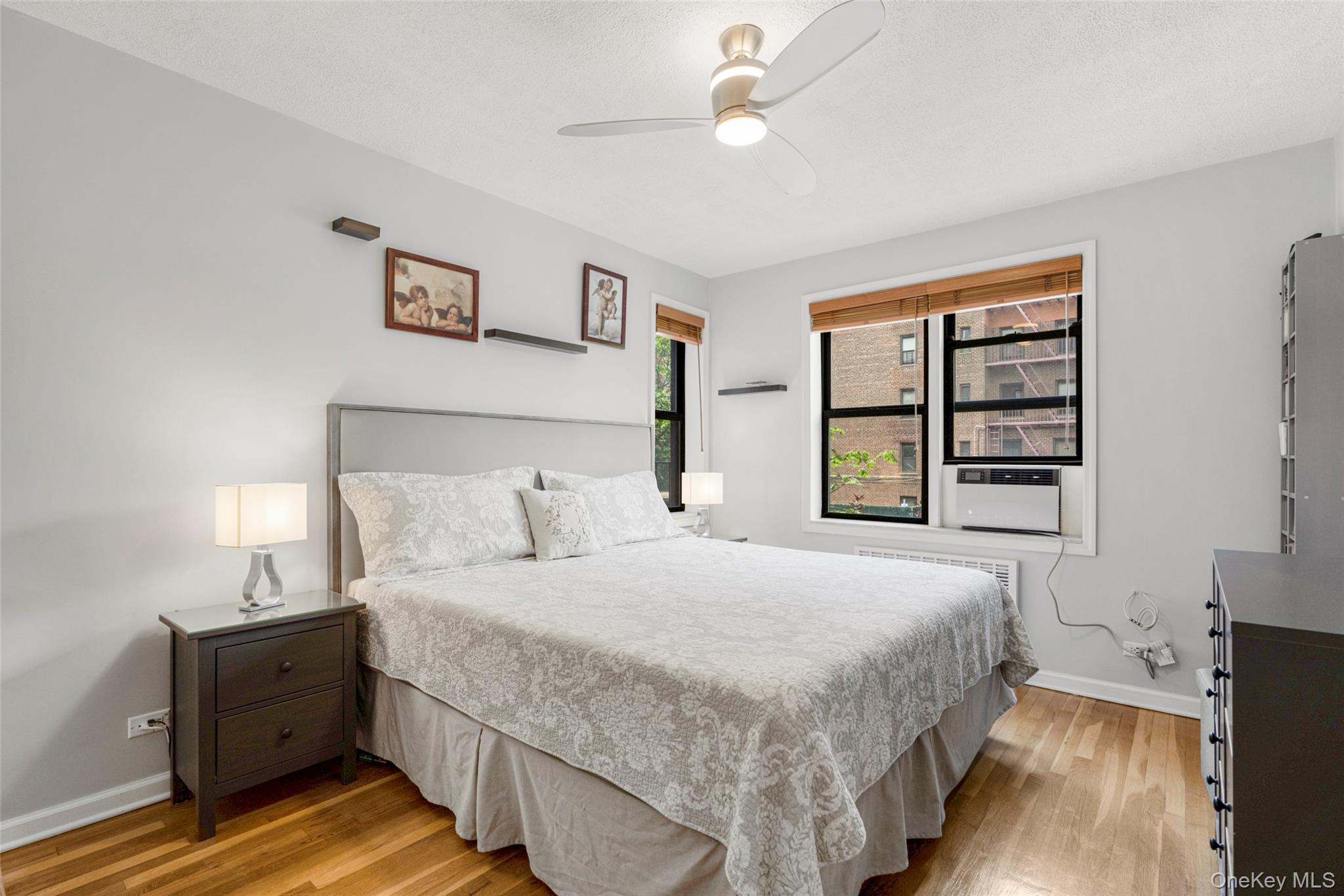 620 West 239th Street, Unit 2C Bronx, NY 10463 - Photo 9 of 19 a bedroom with a bed and a window