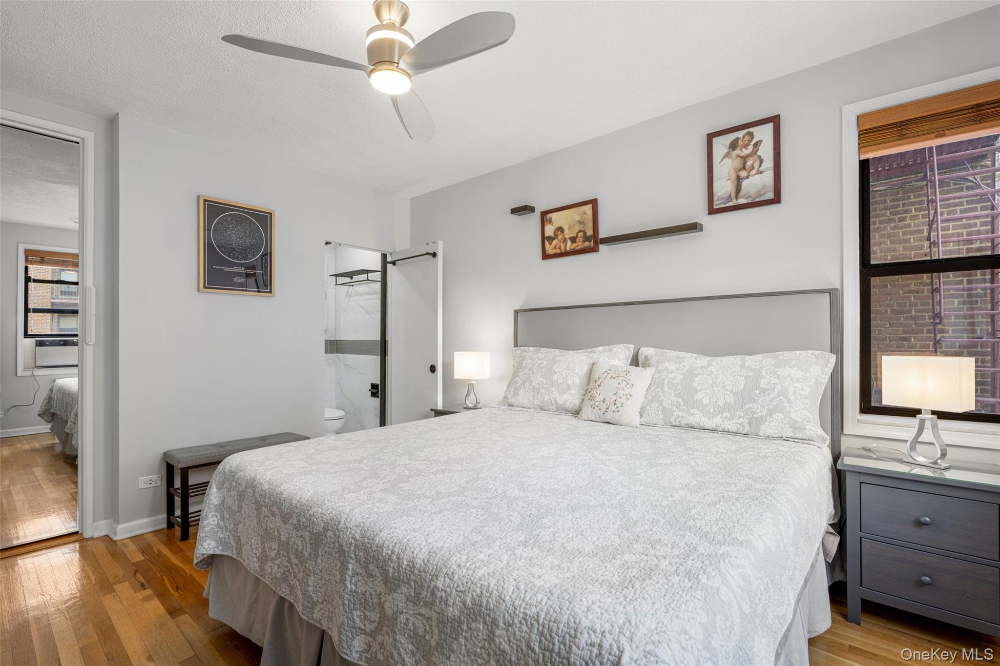 620 West 239th Street, Unit 2C Bronx, NY 10463 - Photo 10 of 19 a bed room with a bed and a dresser