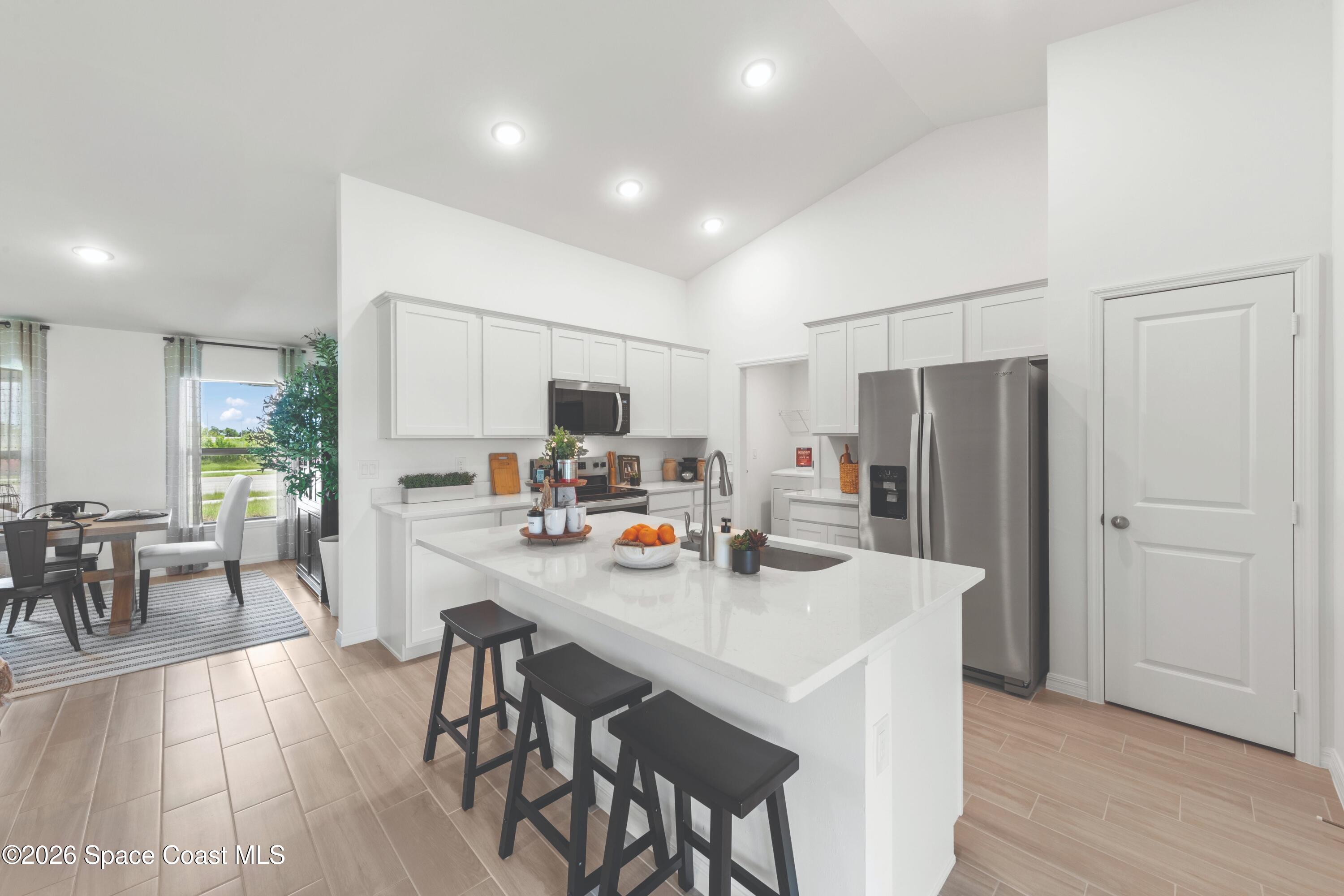 474 Halifax Street Southwest Palm Bay, FL 32908 - Photo 6 of 14 StAugustine_Kitchen-Dining_SPOT_CC_25SEP
