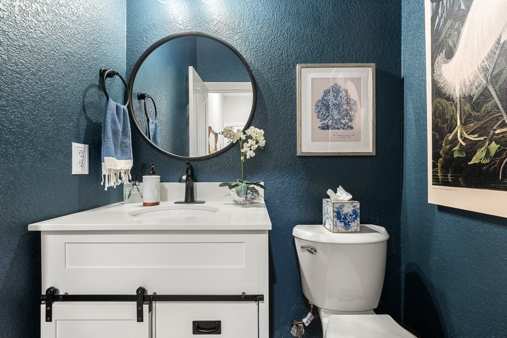 6708 Menchaca Road, Unit 2 Austin, TX 78745 - Photo 25 of 30 White vanity with barn door hardware, an integrated sink, and a white countertop