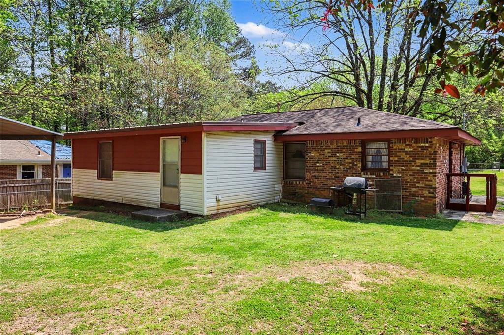 7019 Lake View Lane Doraville, GA 30360 - Photo 30 of 32 a view of a backyard with a small cabin