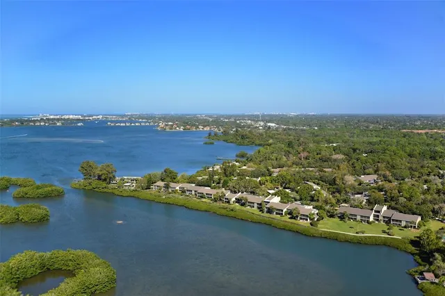 an aerial view of a house with a lake view