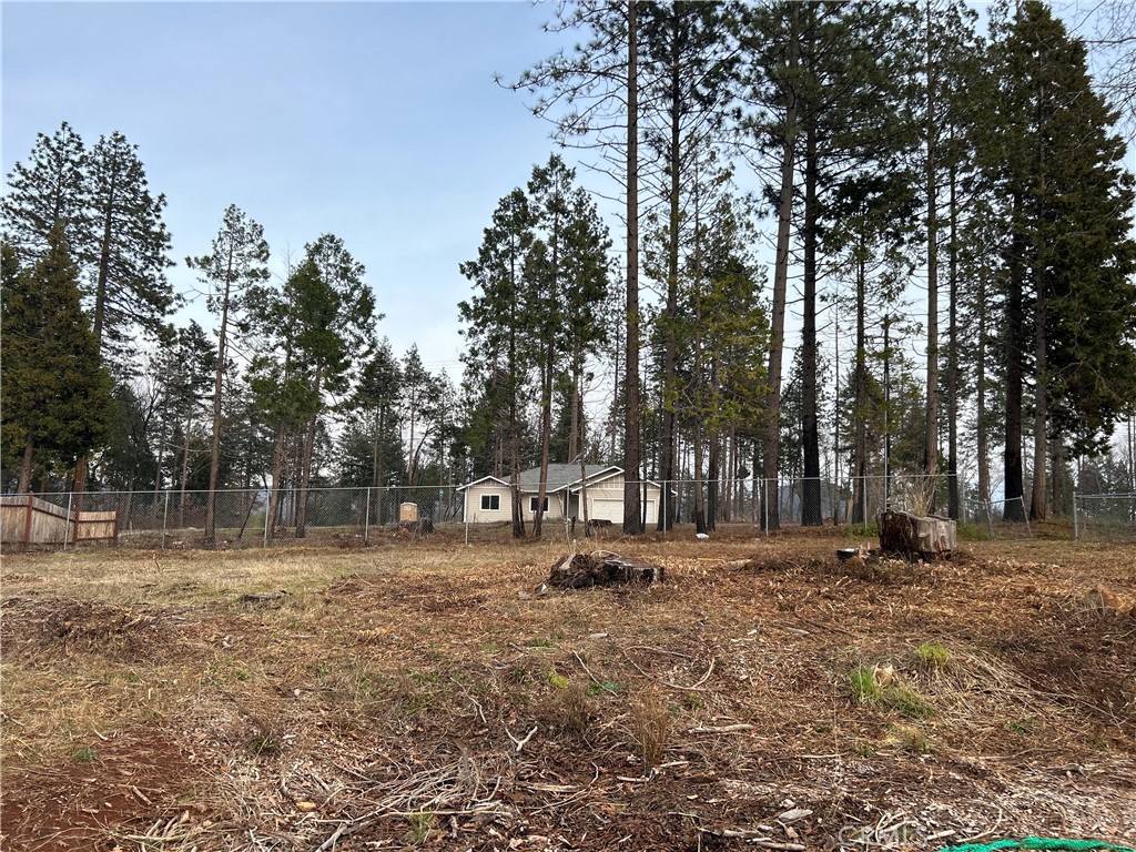 a backyard of a house with trees